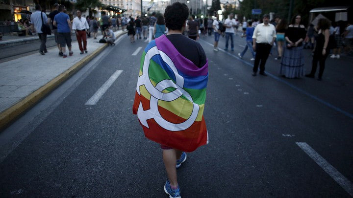 Double Mars Symbol (Large) Flag 3x5ft Wrapped Around Man at PArade