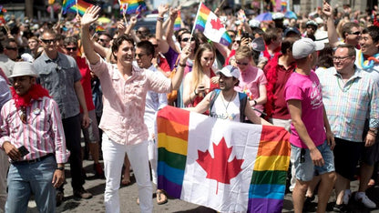 Canada Rainbow Flag 3x5ft held in front of Canadian Prime Minister