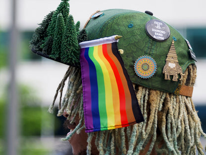 Philly Rainbow Stick Flag affixed in a Hat